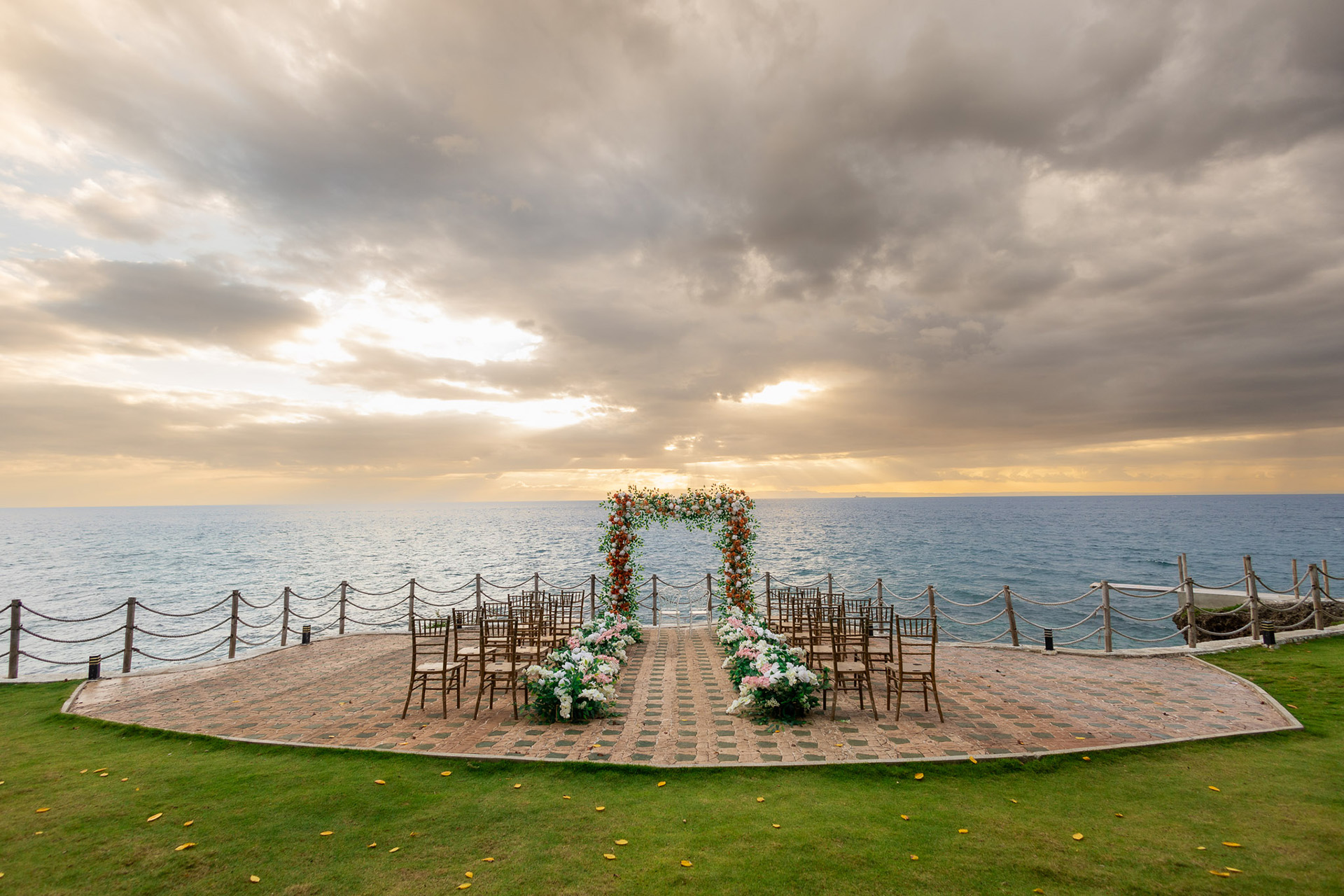 Cliffside ceremony platform at sunset